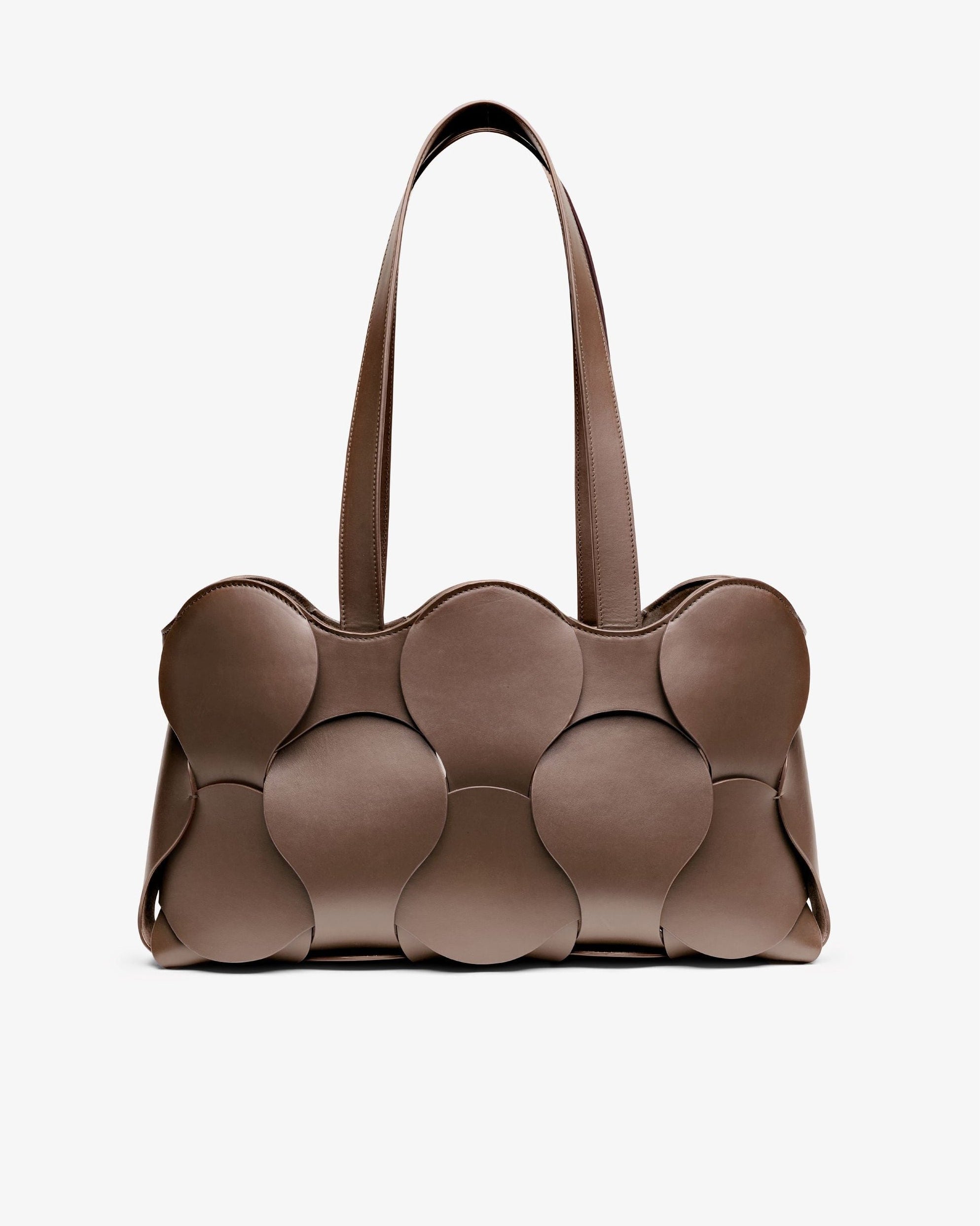 Gigi tote in Fawn Italian calfskin leather, handmade in NYC, with circular woven motif, removable suede drawstring pouch, and suede-backed interior