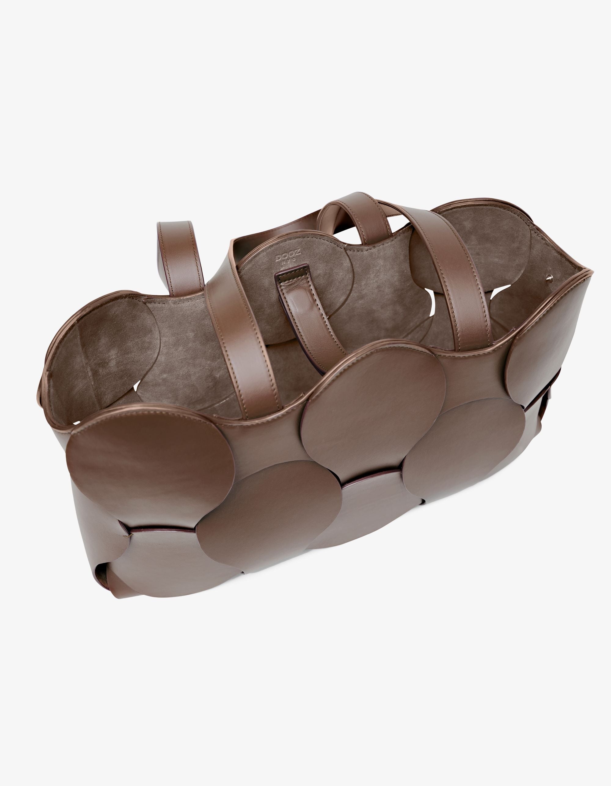 Dooz Gigi tote in Italian leather, sculptural design, circular woven detail, suede-backed interior, and removable pouch