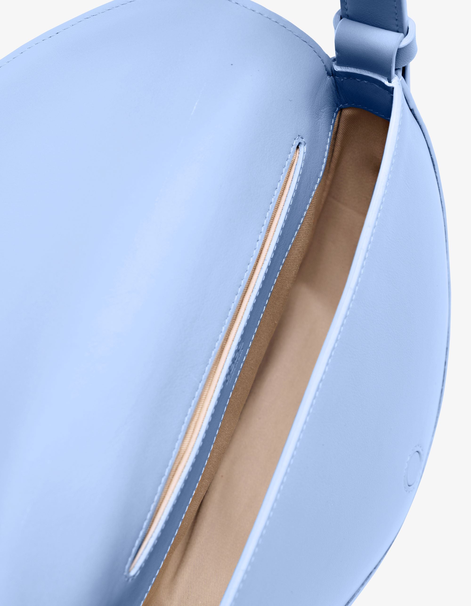 Light blue handbag with a strap on a plain background