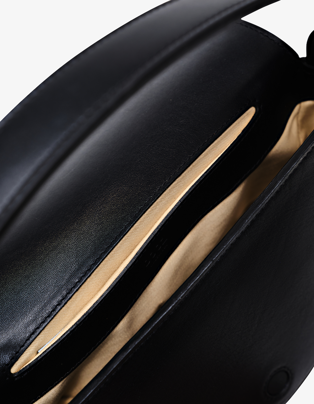 Black Celeste bag with refined craftsmanship, clean lines, and adjustable strap for crossbody or shoulder wear