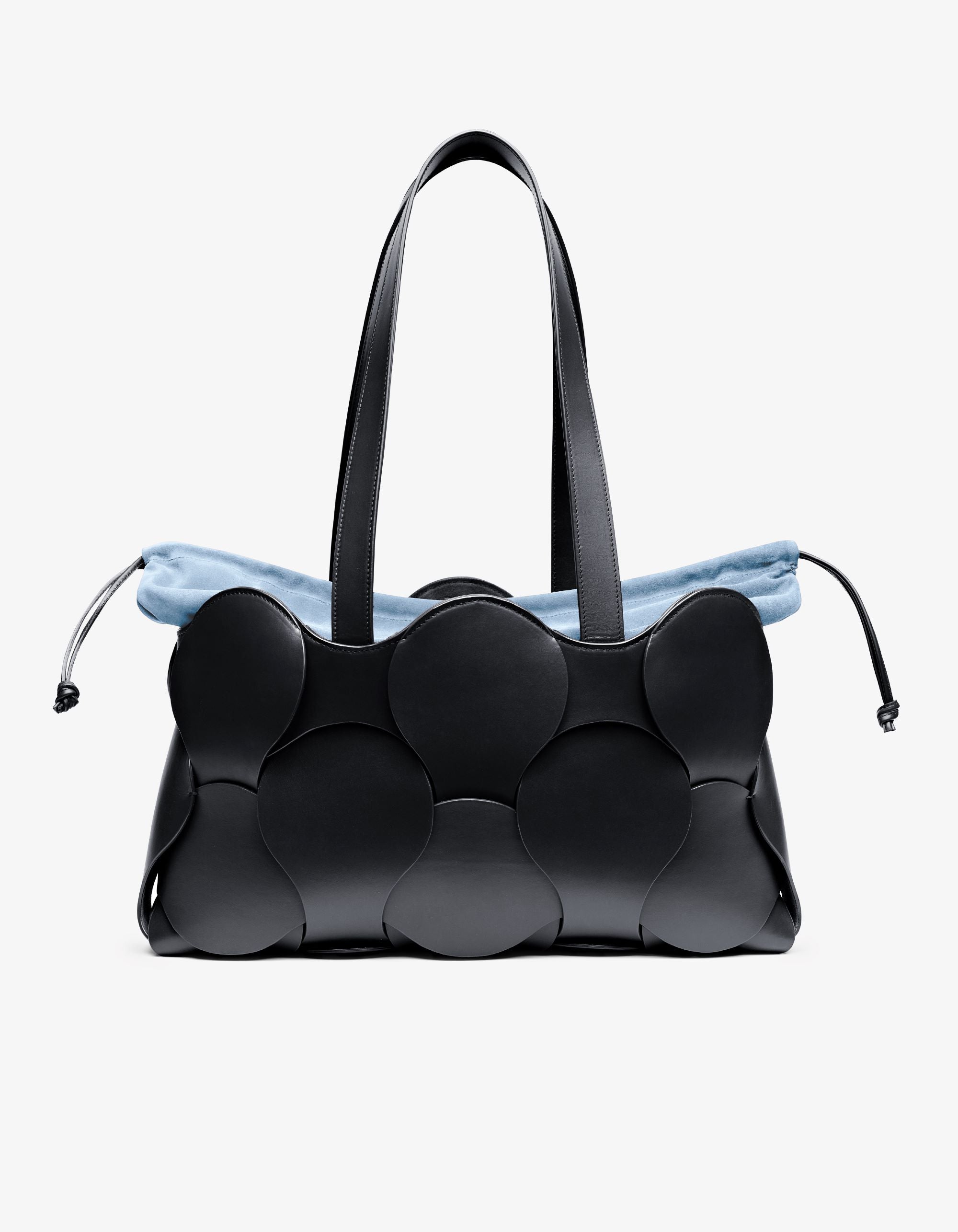A black Gigi Tote handbag made from Italian calfskin leather, featuring a spacious design with a blue drawstring detail.