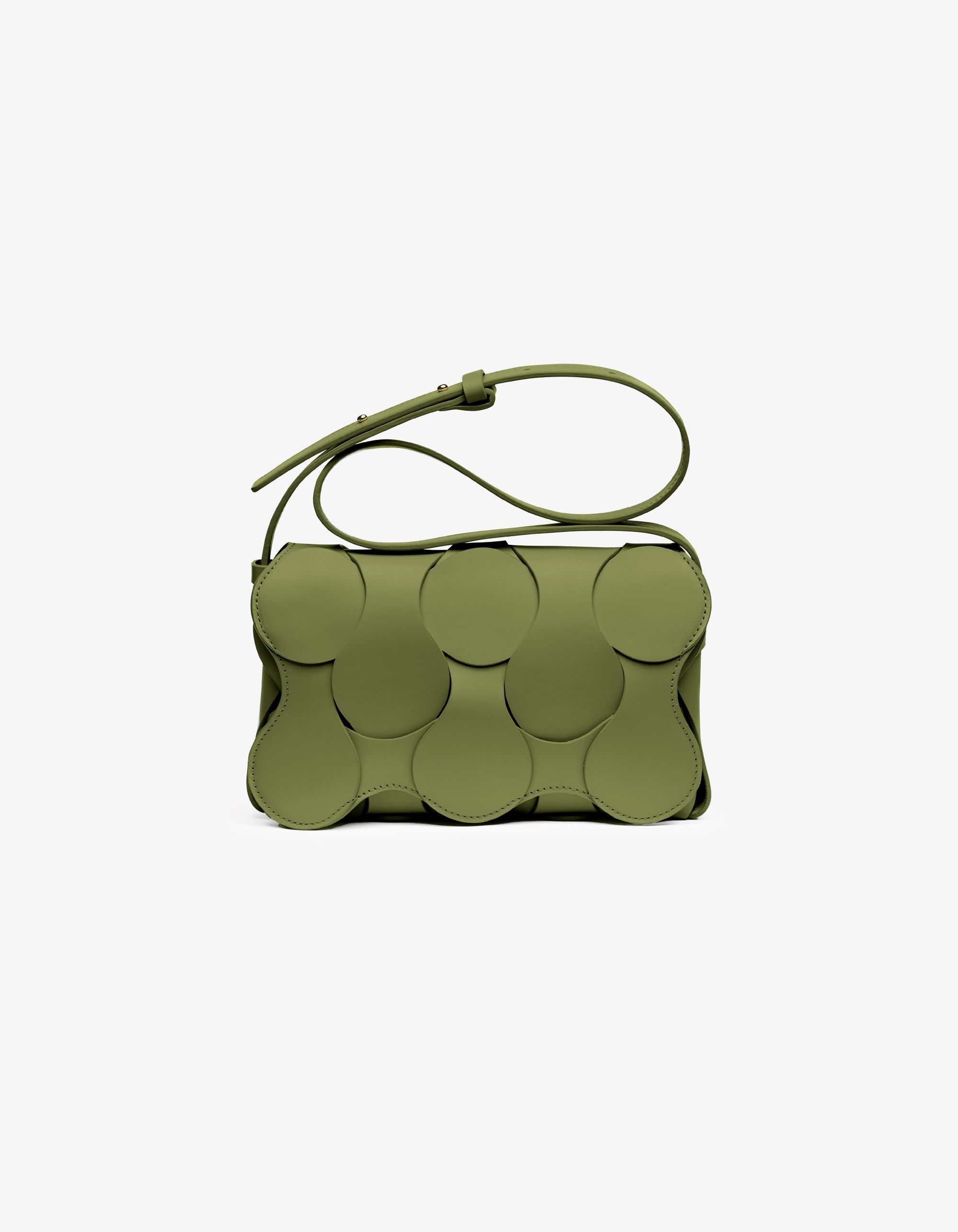 Dooz Gigi bag in moss Italian calfskin leather, hand-stitched, sculptural design, woven circular detail, magnetic flap, and versatile strap