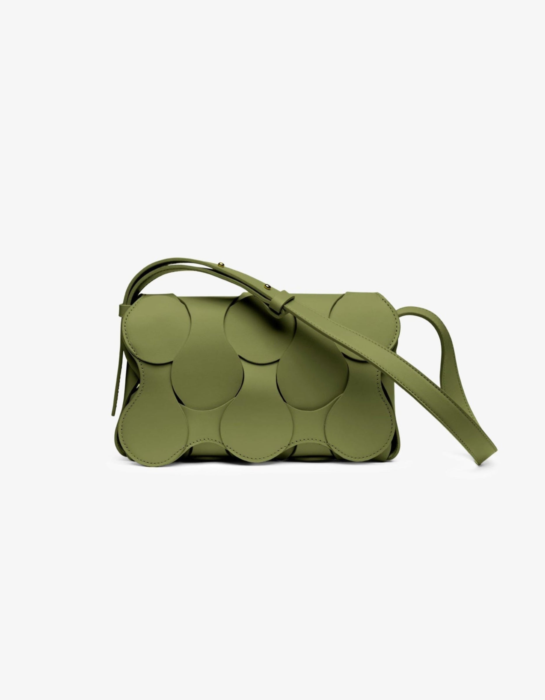 A green leather handbag with a unique sculptural design, featuring multiple curved sections arranged in an overlapping pattern, with a smooth finish and a suede interior.