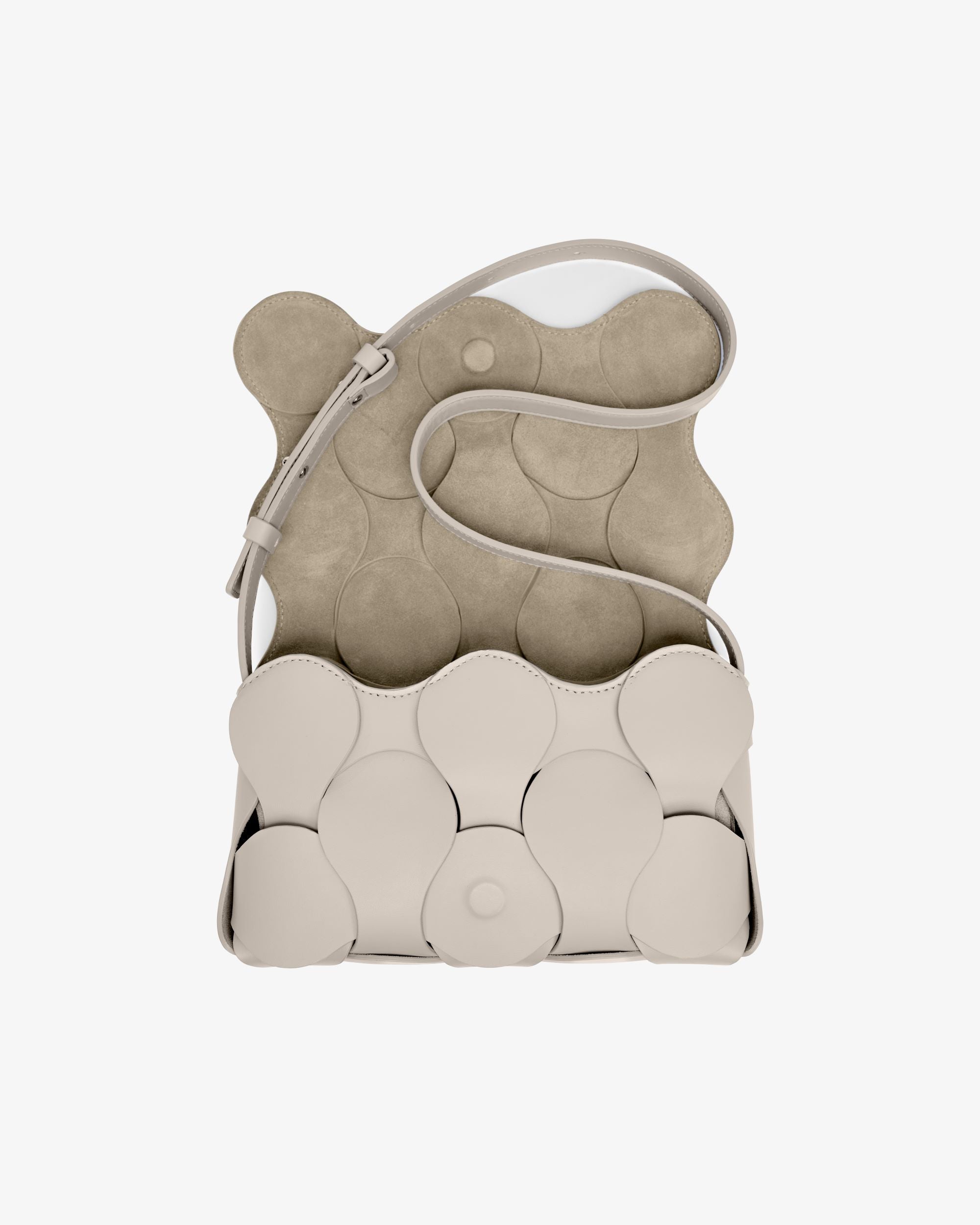 Off white Gigi bag with NYC-made Italian leather, sculptural design, woven circular motif, and convertible strap