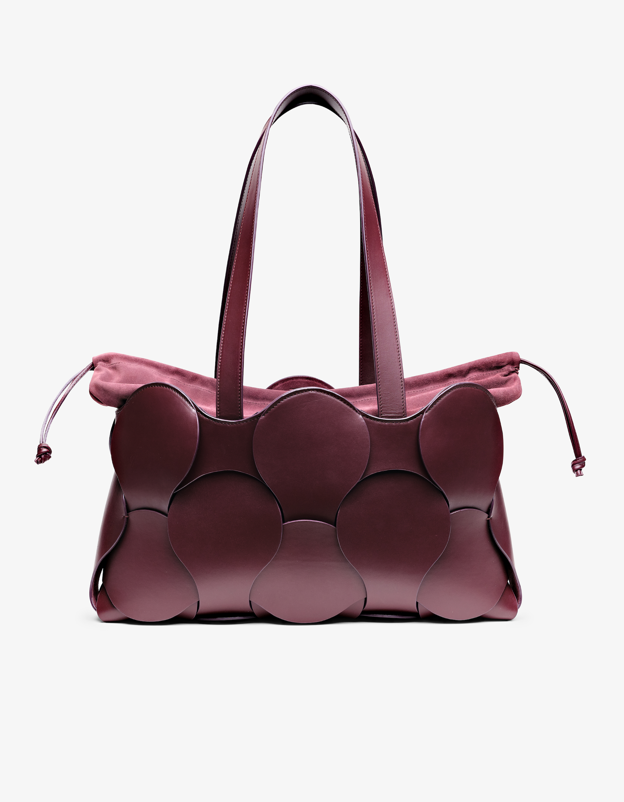 A burgundy Gigi Tote handbag made from smooth leather, featuring a spacious design with two handles and a drawstring liner.