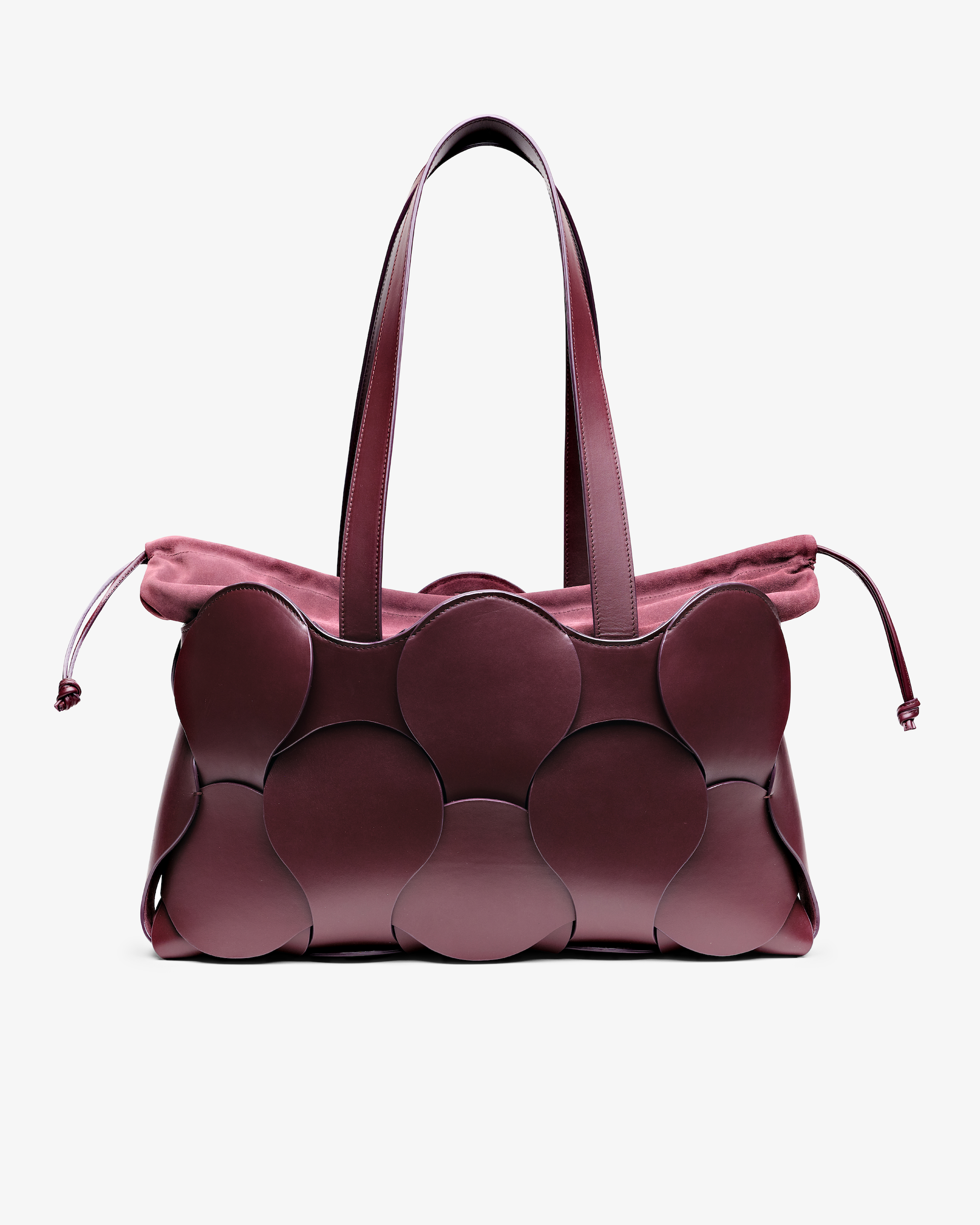 A burgundy Gigi Tote handbag made from smooth leather, featuring a spacious design with two handles and a drawstring liner.