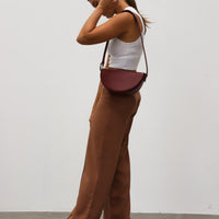 Dooz virgo celeste bag burgundy red long shoulder strap handbag half moon shape with magnetic flap closure 