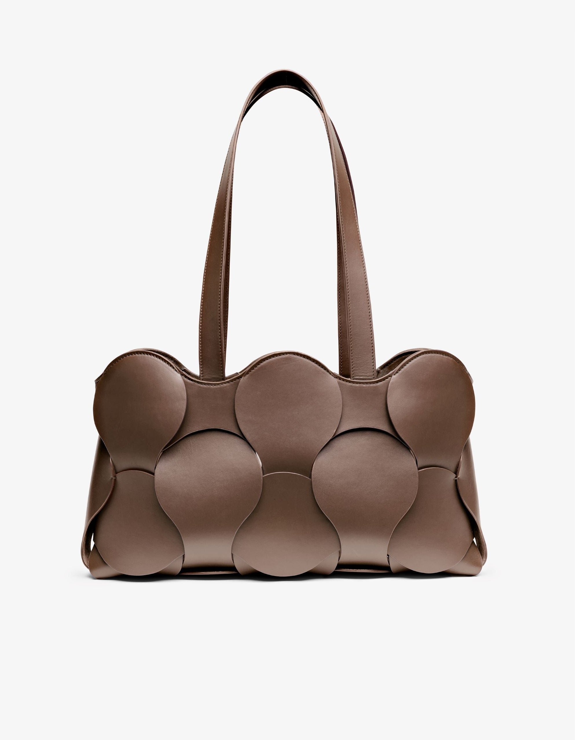 Gigi tote in Fawn Italian calfskin leather, handmade in NYC, with circular woven motif, removable suede drawstring pouch, and suede-backed interior