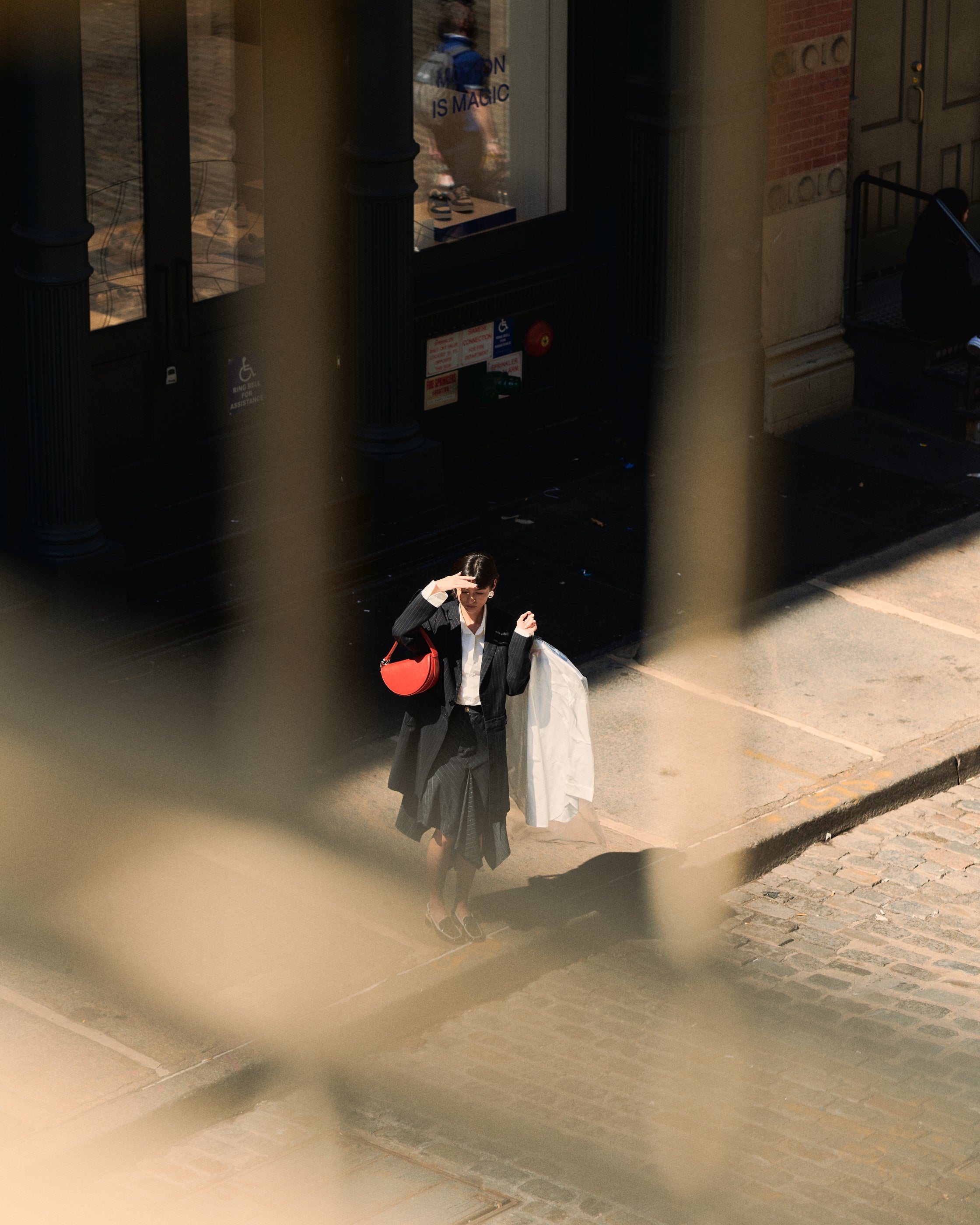 Dooz Celeste Bag in red on model in New York City