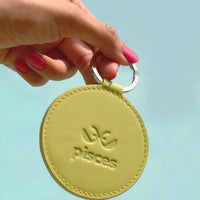 Dooz Pisces lime green leather keychain on model