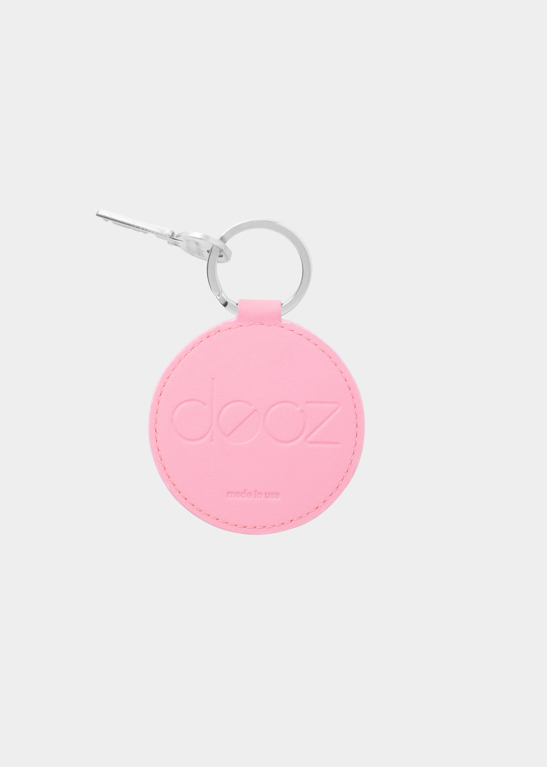 Dooz Libra blush pink leather keychain with embossed logo and silver keyring