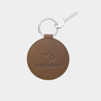 Dooz Capricorn olive green leather keychain with embossed zodiac glyph and silver keyring