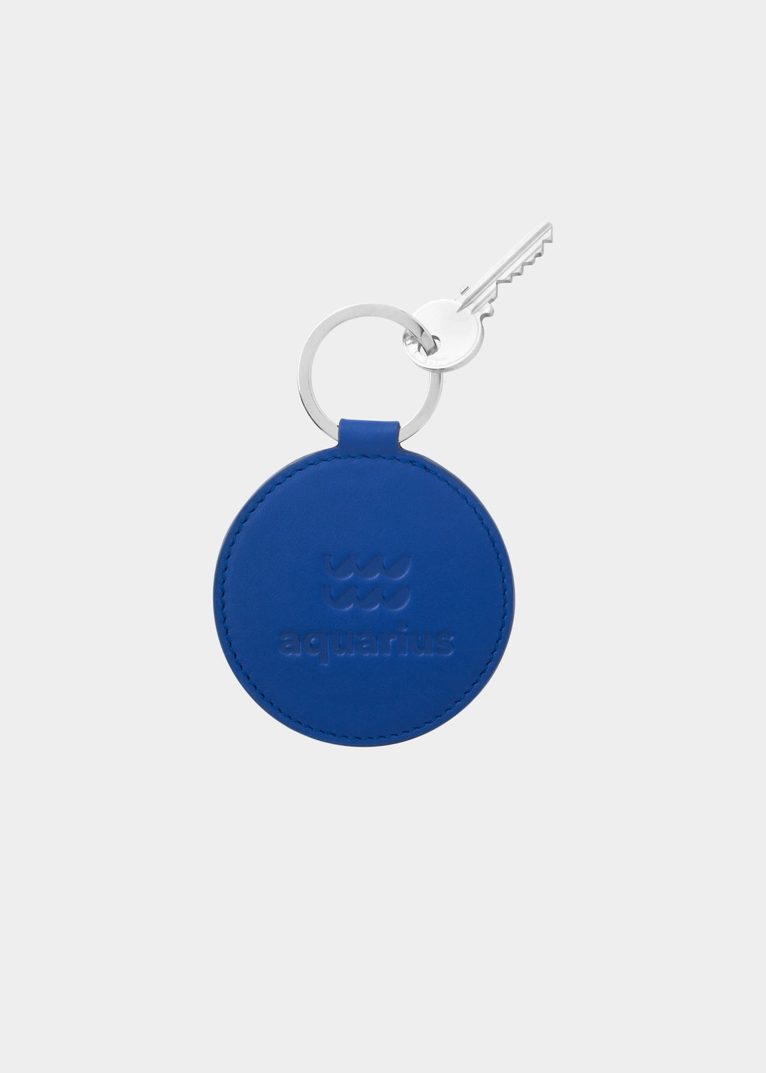 Dooz Aquarius cobalt blue leather keychain with embossed zodiac glyph and silver keyring