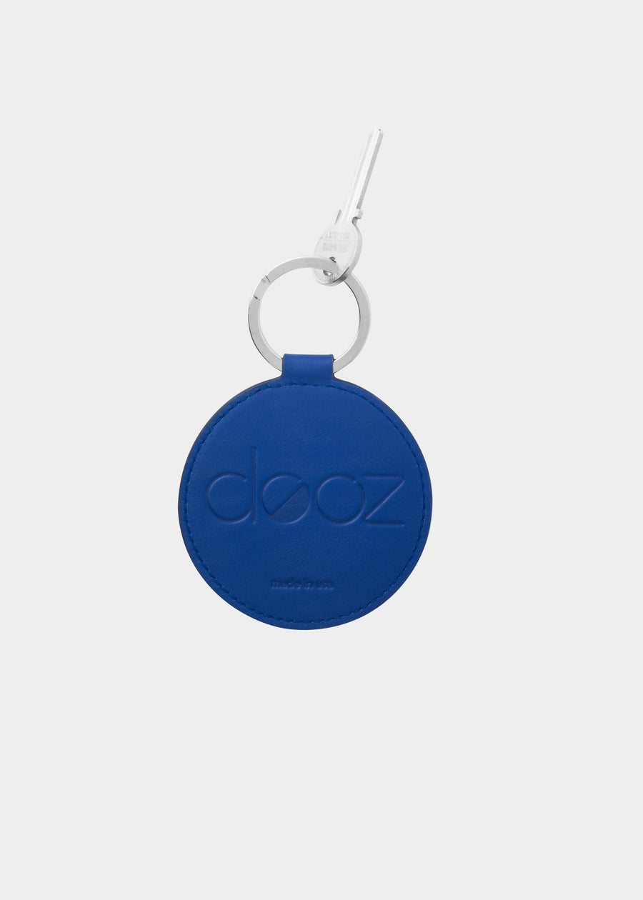 Dooz Aquarius cobalt blue leather keychain with embossed logo and silver keyring