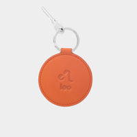 Dooz Leo orange leather keychain with embossed zodiac glyph and silver keyring