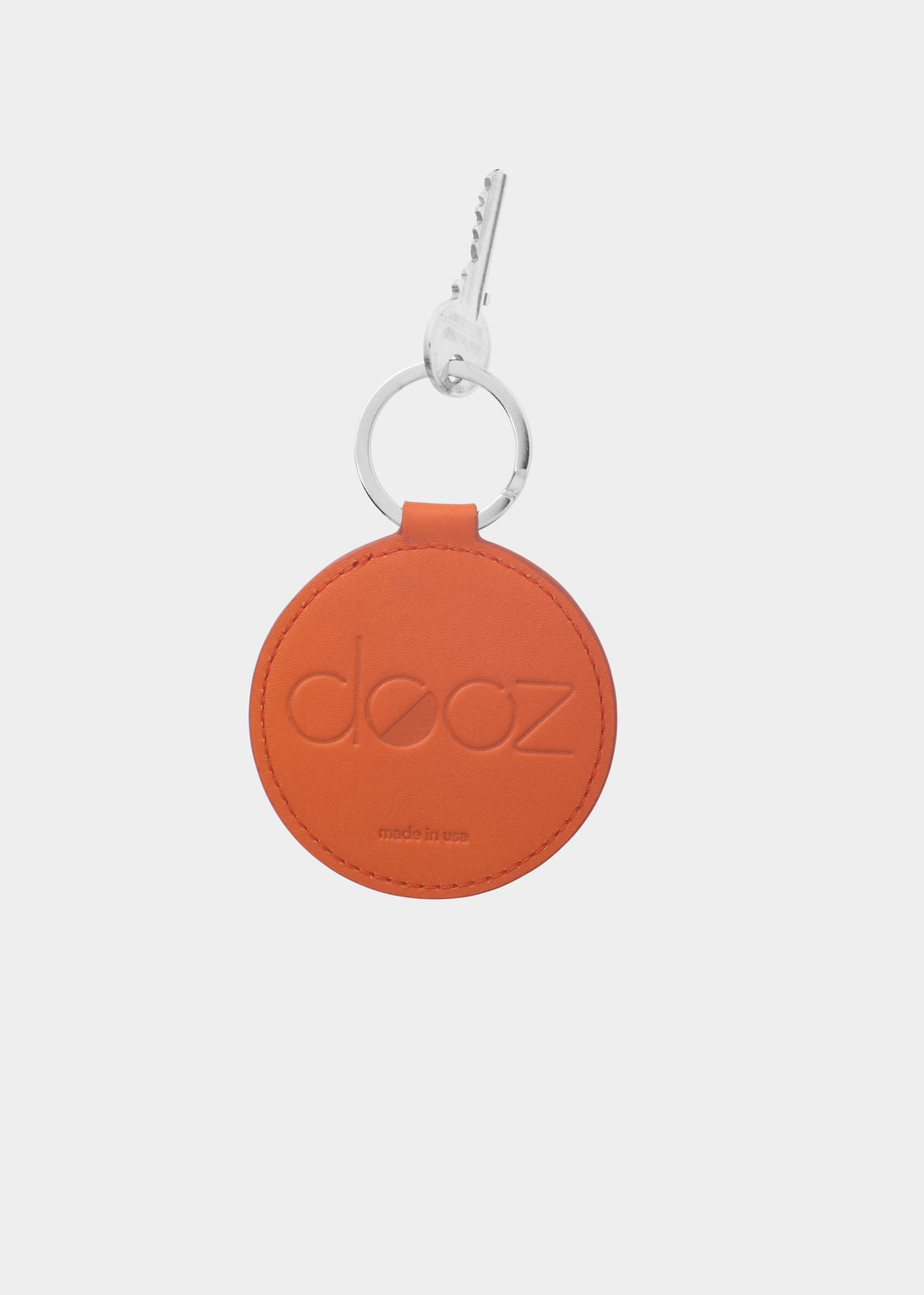 Dooz Leo orange leather keychain with embossed logo and silver keyring