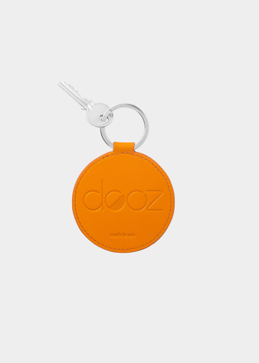 Dooz Gemini golden leather keychain with embossed logo and silver keyring