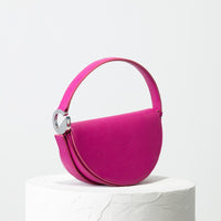 Dooz Sagittarius fuchsia pink leather half moon handbag with front magnetic flap and short strap
