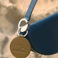 Dooz Capricorn olive green embossed leather keychain with Celeste handbag
