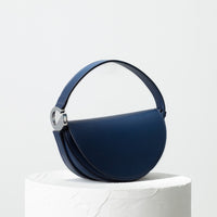 Dooz Scorpio navy leather half moon handbag with short strap and front magnetic flap