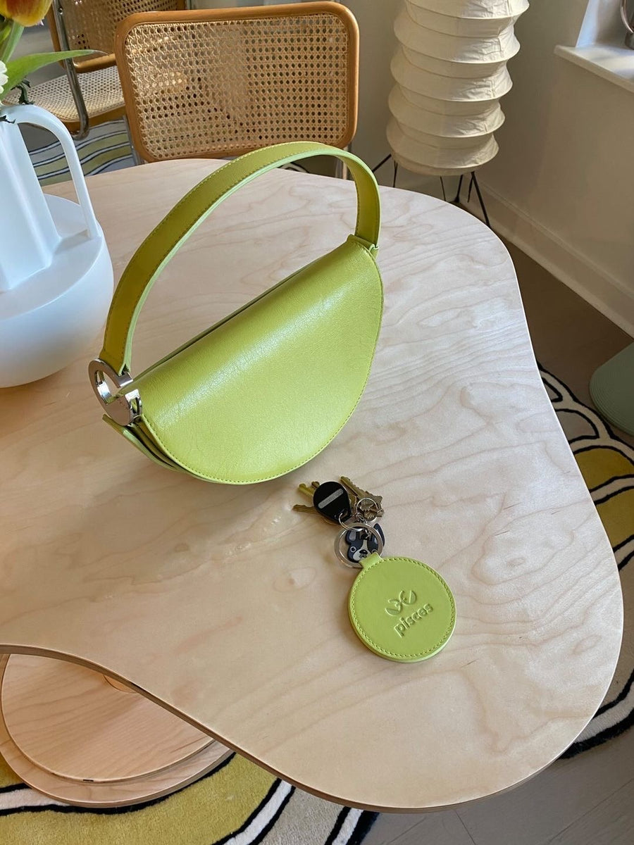 DOOZ Pisces keychain key fob lifestyle with pisces handbag