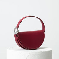 Dooz Virgo burgundy leather half moon handbag with short strap and magnetic front flap modern design