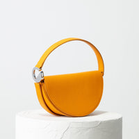 Dooz Gemini golden yellow half moon leather handbag with short strap power of color