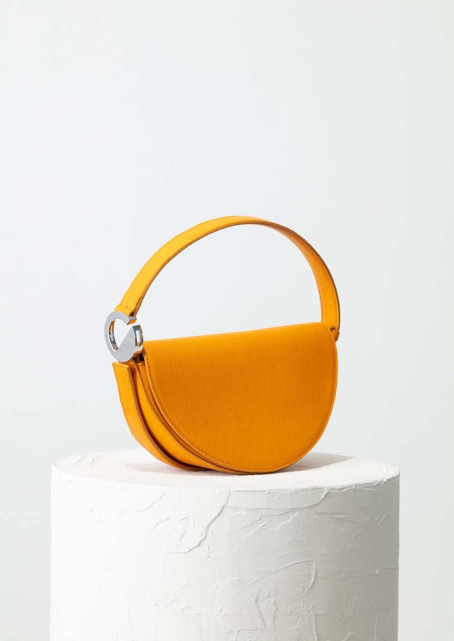 Dooz Gemini golden yellow half moon leather handbag with short strap power of color