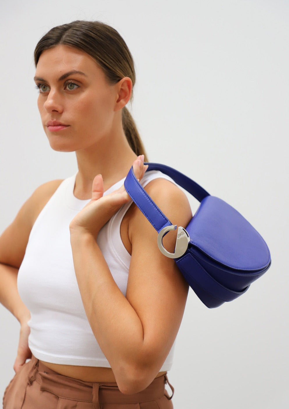 Dooz aquarius leather handbag cobalt blue power color empowerment logo silver hardware