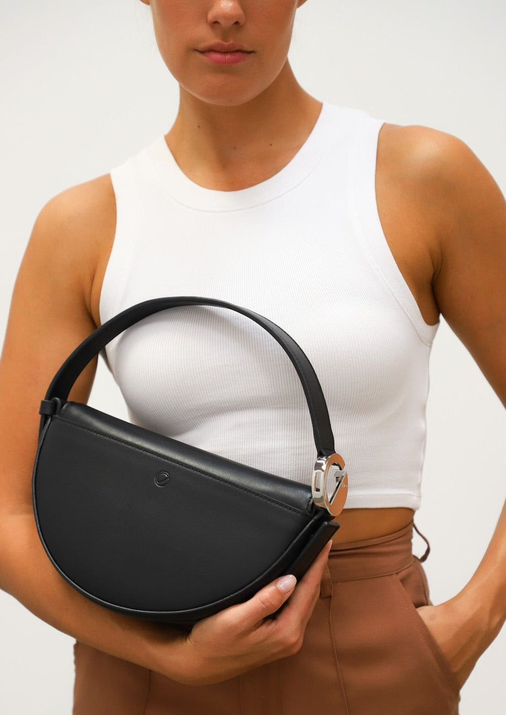 Dooz eclipse black italian leather short handle handbag with logo embossed back pocket