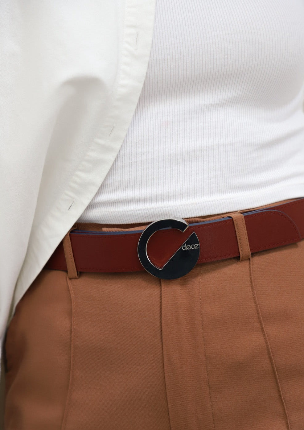 Dooz reversible leather belt detail with silver metal hardware buckle