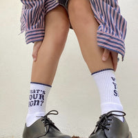 Dooz cotton blend white sport socks with What's Your Sign? intarsia on model