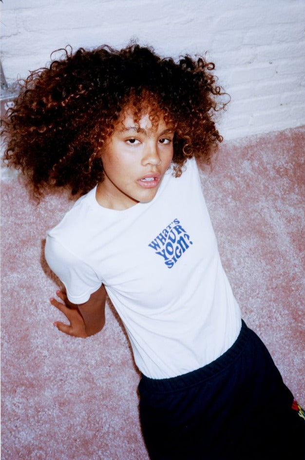 Dooz What's Your Sign? white cotton t-shirt with sweatskirt on model